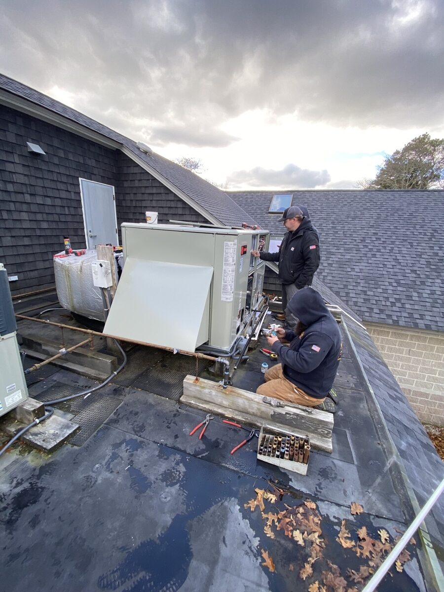 3c12f4fb-... — HVAC technician working on rooftop equipment