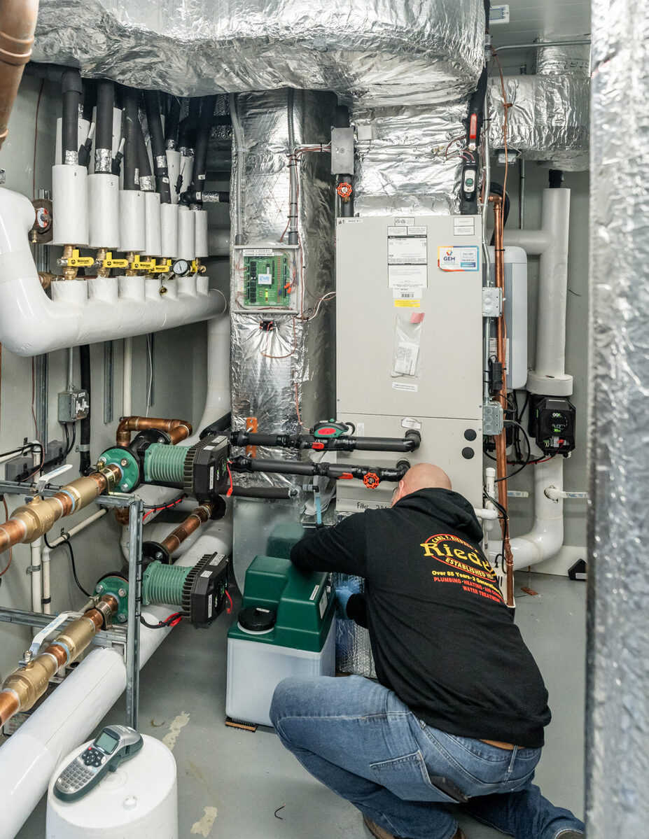 HVAC technician Jason O. working on equipment