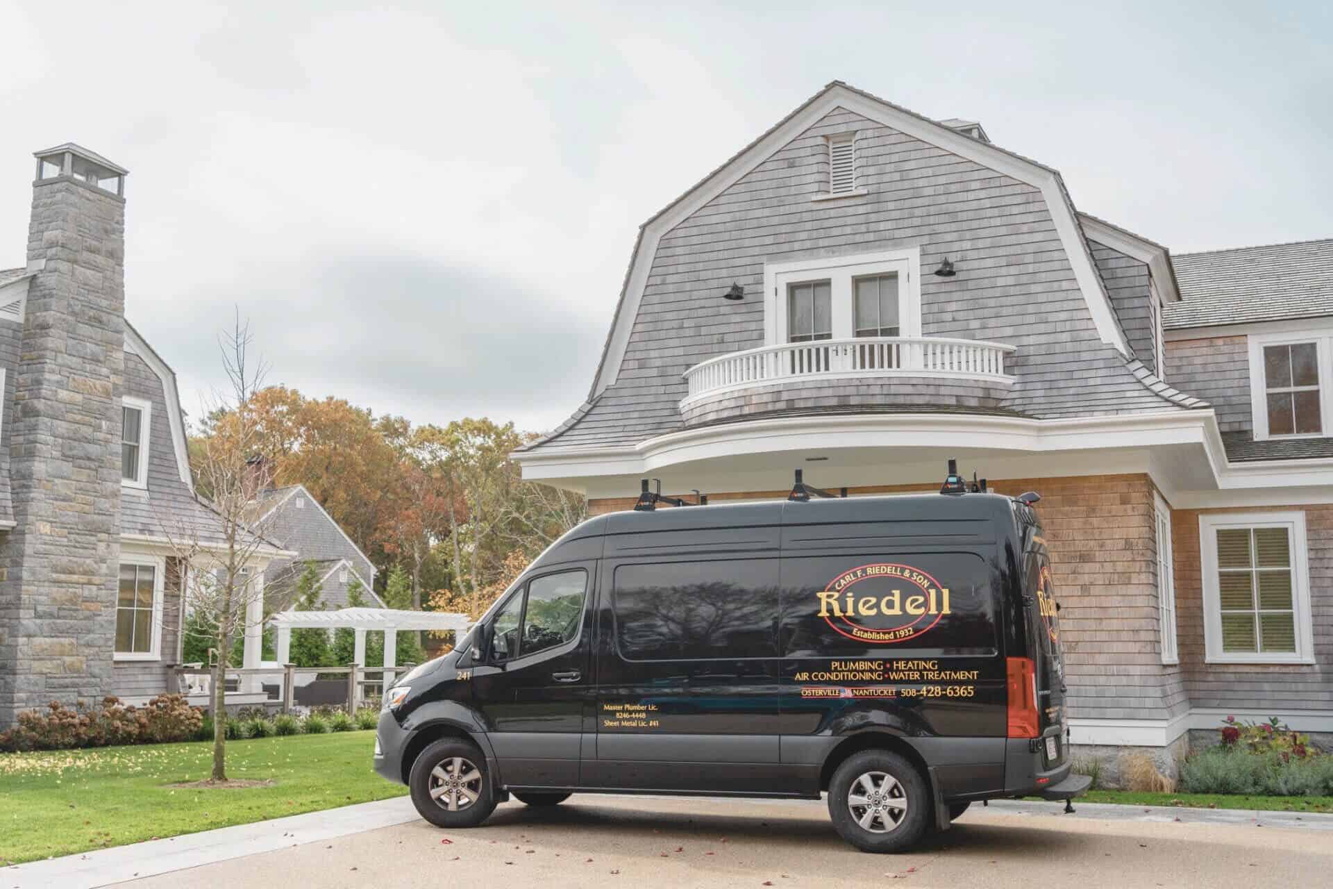 company van outside of a house