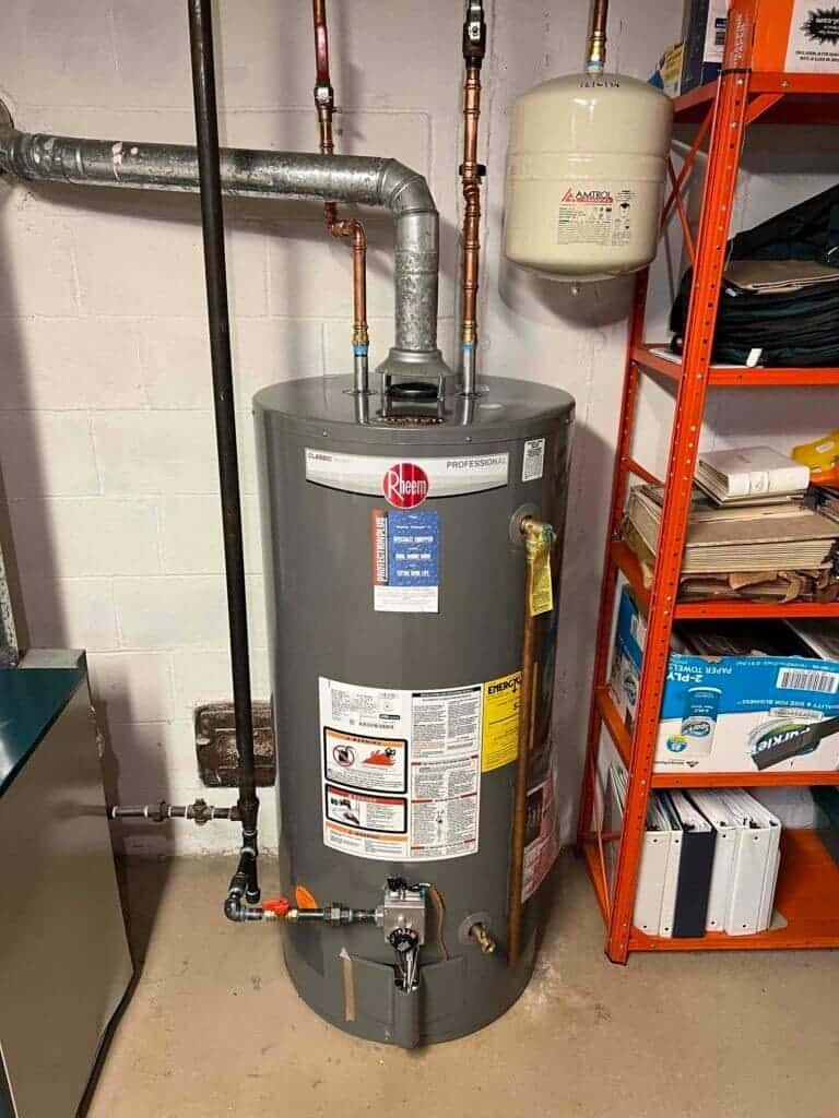 Technician servicing a residential water heater