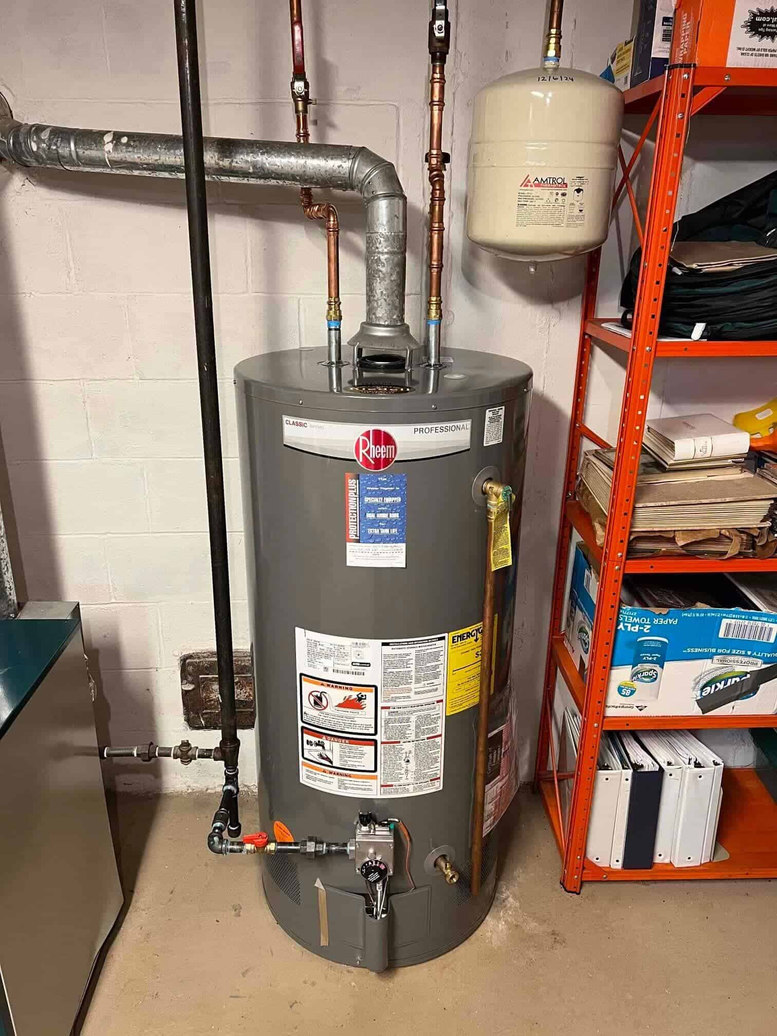 Technician servicing a residential water heater