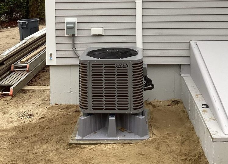 ECOER air-source heat pump unit installed outside a residential home